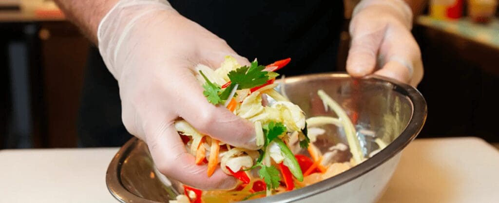 A cook making a salad