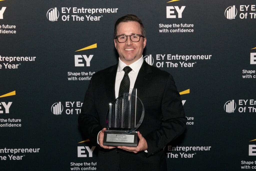 Jon Schniepp holding Entrepreneur Of The Year® Award