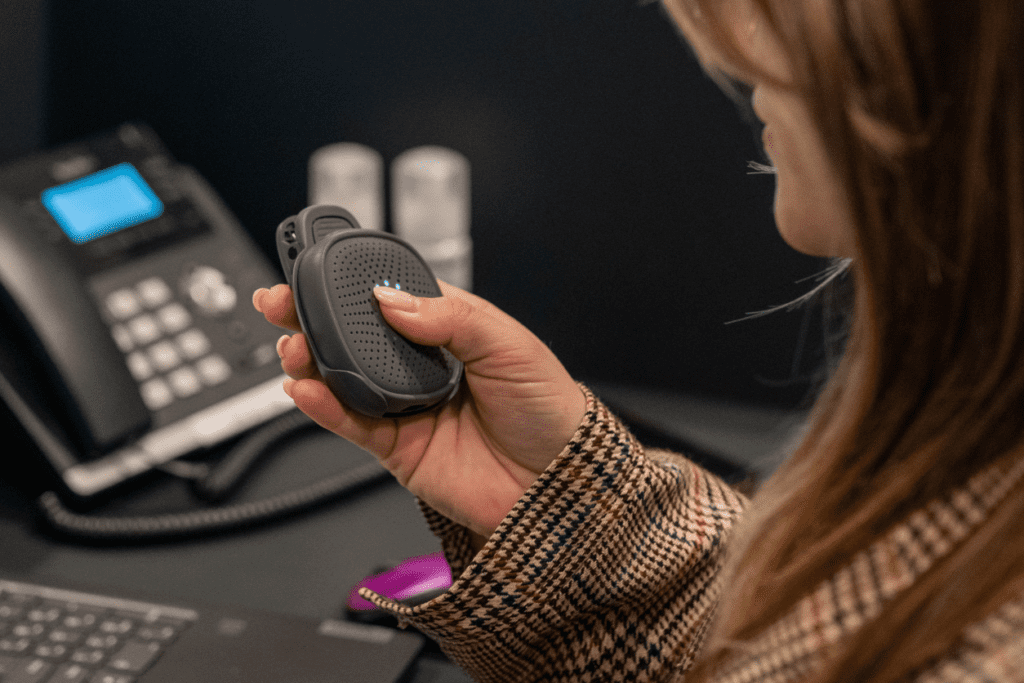 A receptionist using Relay at the front desk.