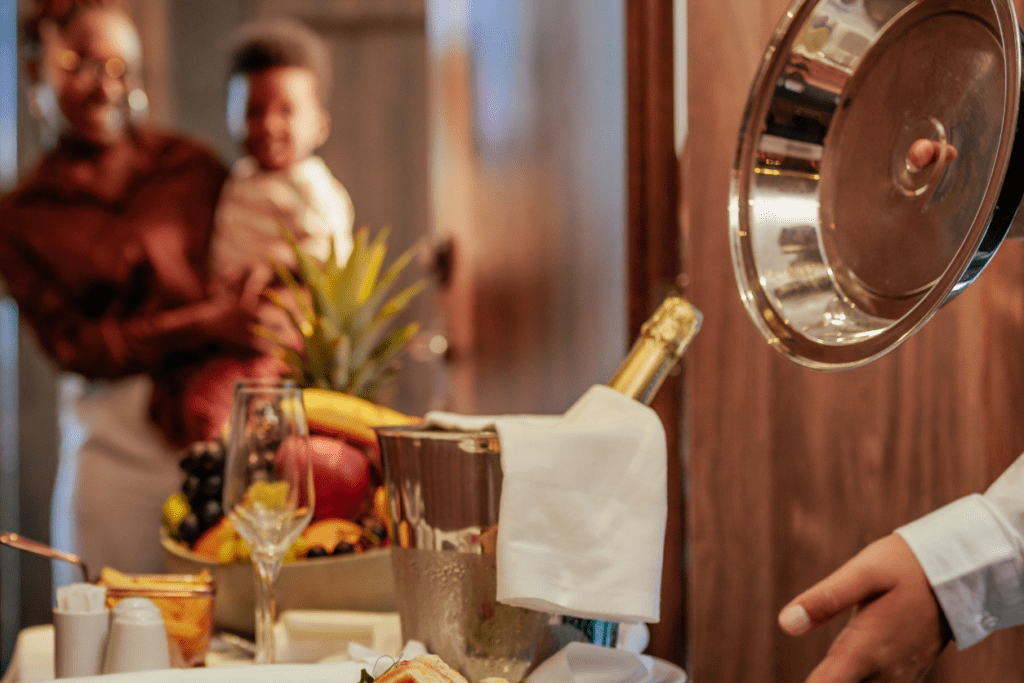Room service delivering Champagne and food to a guest.