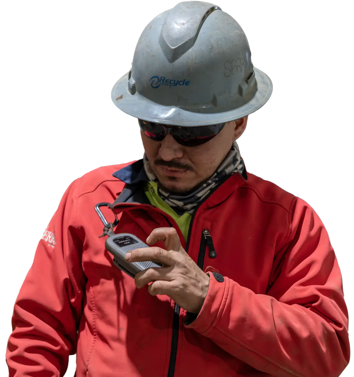 A construction worker wearing a hard hat and safety gear uses a RelayX communication device for clear, reliable team communication on an industrial job site.