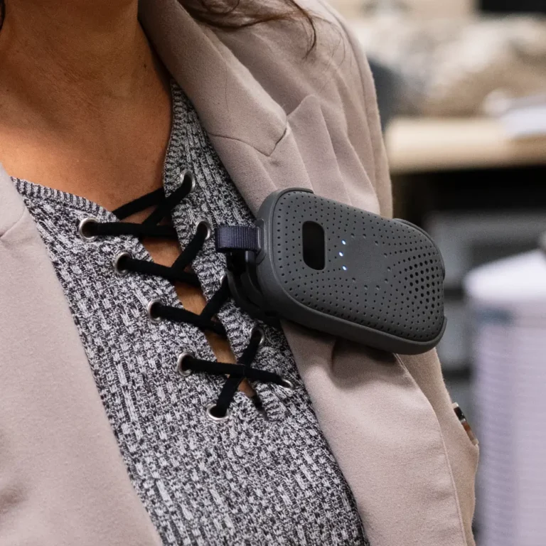 RelayM clipped to a user's shirt during use