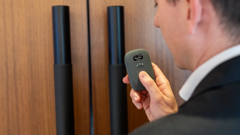 A member of a hotel staff using RelayM to send a message.