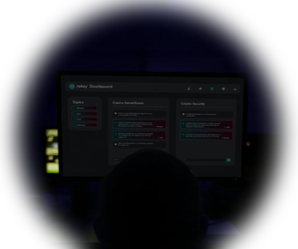 A security team member monitors a computer screen displaying the Relay dashboard, showing active channel scanning for casino surveillance and security alerts in a dark control room.