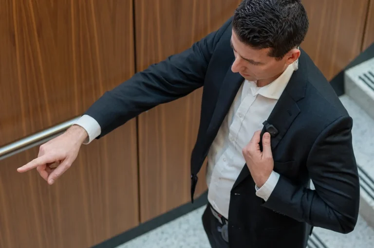 Man in office building using Relay for two way radio communication